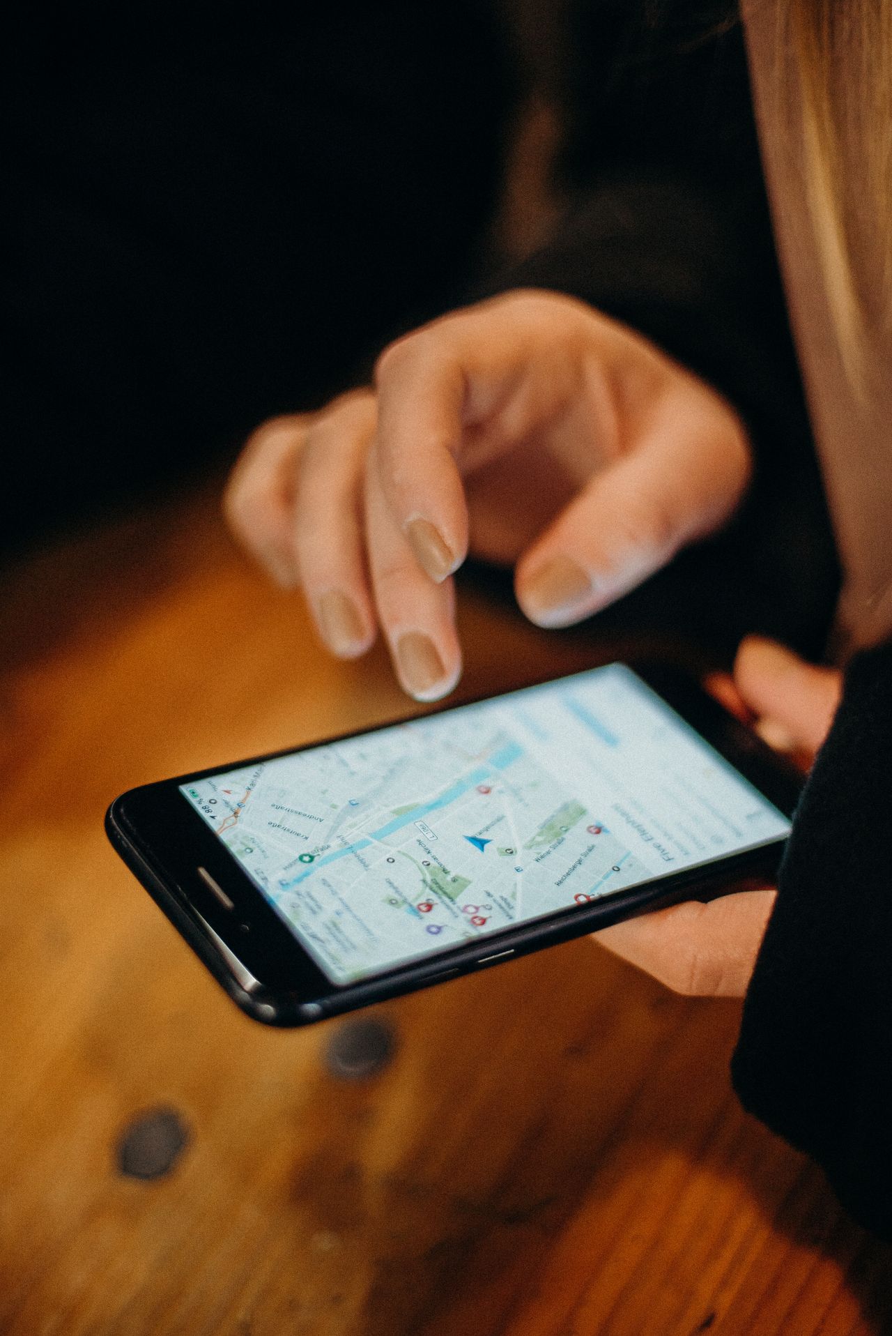 Traveler using phone map app at a cafe — how much data does navigation use abroad
